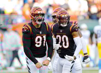 Dec 5, 2021; Cincinnati, Ohio, USA; Cincinnati Bengals defensive end Trey Hendrickson (91) celebrates the sack with cornerback Eli Apple (20) during the third quarter against the Los Angeles Chargers at Paul Brown Stadium. Mandatory Credit: Joseph Maiorana-USA TODAY Sports