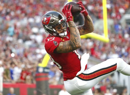 Dec 12, 2021; Tampa, Florida, USA; Tampa Bay Buccaneers wide receiver Mike Evans (13) catches the ball for a touchdown against the Buffalo Bills during the first half at Raymond James Stadium. Mandatory Credit: Kim Klement-USA TODAY Sports